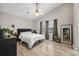 A primary bedroom featuring vaulted ceiling, fan, and view into en-suite bath at 207 Allen Richard Ct # B, Moncks Corner, SC 29461