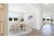 Bright dining room featuring large windows, a modern chandelier, and stylish decor at 218 Yalton St, Summerville, SC 29486
