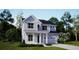 Charming two-story home with light blue siding, white trim, and a covered front porch at 218 Yalton St, Summerville, SC 29486