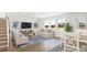 Well-lit living room with neutral furniture, large windows, and modern decor at 218 Yalton St, Summerville, SC 29486