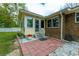 A cozy back patio leads to the sunroom, brick pavers, and white rock landscaping at 2233 Glendale Dr, Charleston, SC 29414