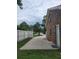 The long driveway leads to a brick building with white trim and a white fence at 2233 Glendale Dr, Charleston, SC 29414