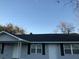 Charming home with a new black roof, light gray siding, black shutters and white doors at 2317 Elegans Drive Dr, North Charleston, SC 29405