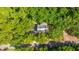 Aerial view of the property highlighting its secluded location and mature landscaping at 2468 Marina Rd, Wadmalaw Island, SC 29487