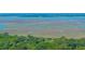 Stunning aerial view of vast marshlands intersected by winding waterways, showcasing coastal beauty at 2468 Marina Rd, Wadmalaw Island, SC 29487