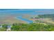 Scenic aerial view capturing the serene waterways and marshlands surrounding a coastal property at 2468 Marina Rd, Wadmalaw Island, SC 29487
