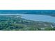 Sweeping aerial image displaying a scenic coastline with docks, boats, and lush landscapes at 2468 Marina Rd, Wadmalaw Island, SC 29487