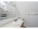 Bathroom with a vanity and a large mirror. Skylight visible in the mirror at 2468 Marina Rd, Wadmalaw Island, SC 29487