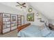 Comfortable bedroom features a vaulted ceiling, large window and custom shelves at 2468 Marina Rd, Wadmalaw Island, SC 29487