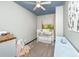 Charming Bedroom featuring a white crib and a vintage dresser at 2468 Marina Rd, Wadmalaw Island, SC 29487