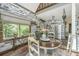 Charming dining area featuring white shiplap accents, with easy access to the kitchen and outdoor deck at 2468 Marina Rd, Wadmalaw Island, SC 29487
