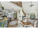 Open dining area featuring a wood table, stainless steel appliances, and cozy seating at 2468 Marina Rd, Wadmalaw Island, SC 29487