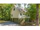Charming home featuring a lush yard and classic architectural details at 2468 Marina Rd, Wadmalaw Island, SC 29487