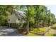 Charming two-story home with a fenced yard and mature trees at 2468 Marina Rd, Wadmalaw Island, SC 29487