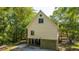 Charming exterior view of an elevated coastal home featuring a light-colored exterior and serene surroundings at 2468 Marina Rd, Wadmalaw Island, SC 29487