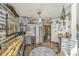 Bright kitchen with butcher block counters, gray cabinets, and stainless steel appliances, perfect for the home chef at 2468 Marina Rd, Wadmalaw Island, SC 29487