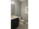Stylish powder room with patterned floors and modern fixtures at 260 Huguenot Trl, Huger, SC 29450