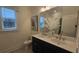 Bathroom with a double vanity, white countertops, and decorative mirror at 260 Huguenot Trl, Huger, SC 29450