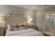A beautifully decorated bedroom featuring neutral tones, stylish wall art, and an en suite bathroom at 260 Huguenot Trl, Huger, SC 29450