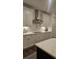 Modern kitchen with sleek appliances, white countertops, and a stainless steel range hood at 260 Huguenot Trl, Huger, SC 29450