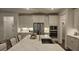 Bright kitchen featuring a central island, stainless appliances, and white cabinets at 260 Huguenot Trl, Huger, SC 29450