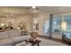 Spacious living room with open layout to the kitchen and dining areas at 260 Huguenot Trl, Huger, SC 29450