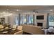 Open-concept living room with fireplace and plenty of natural light at 260 Huguenot Trl, Huger, SC 29450
