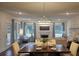 Bright living room with large windows, fireplace, and modern decor at 260 Huguenot Trl, Huger, SC 29450