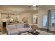 Inviting living room with open layout to the kitchen and dining areas at 260 Huguenot Trl, Huger, SC 29450