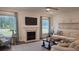 Comfortable living room with fireplace and plush seating area at 260 Huguenot Trl, Huger, SC 29450