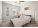 Bedroom featuring a neutral color palette, natural light, and a comfortable bed with decorative pillows at 2747 Calico Bass Ln, Johns Island, SC 29455