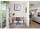 Inviting entryway with hardwood floors, a rustic desk, and a view of the open-concept living area at 2747 Calico Bass Ln, Johns Island, SC 29455