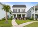Charming two-story home with a welcoming front porch, landscaped yard, and beautiful curb appeal at 2747 Calico Bass Ln, Johns Island, SC 29455