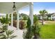 Relaxing front porch featuring white columns and plenty of space to sit and enjoy the outdoors at 2747 Calico Bass Ln, Johns Island, SC 29455