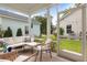 Inviting screened porch with comfortable seating, perfect for enjoying the outdoors with a view of the backyard at 2747 Calico Bass Ln, Johns Island, SC 29455