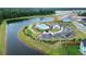 A bird's-eye view of the community pool, playground, and lake, surrounded by lush landscaping at 277 Fiddleback Dr, Summerville, SC 29486