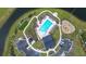 Aerial view showcases the community pool, playground, putting green, and parking area at 277 Fiddleback Dr, Summerville, SC 29486