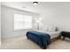 Neutral bedroom with a window, a bed with a blue throw blanket, and a side table at 277 Fiddleback Dr, Summerville, SC 29486