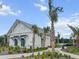 Community clubhouse surrounded by lush landscaping and palm trees, creating a welcoming environment at 277 Fiddleback Dr, Summerville, SC 29486