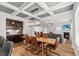 Open-concept dining area with stylish lighting, bar, and seamless transition to the living room at 277 Fiddleback Dr, Summerville, SC 29486