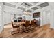 Elegant dining area with coffered ceiling, open layout to kitchen, and stylish furnishings at 277 Fiddleback Dr, Summerville, SC 29486