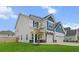 Well-maintained two-story home with a three car garage, manicured lawn, and charming curb appeal at 277 Fiddleback Dr, Summerville, SC 29486