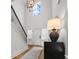 Spacious foyer with high ceilings, stylish light fixture, and staircase with black iron railing at 277 Fiddleback Dr, Summerville, SC 29486