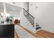 Inviting hallway with hardwood floors, staircase, and open view to the living room at 277 Fiddleback Dr, Summerville, SC 29486