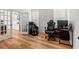 This home office offers natural light, wood flooring, and a comfortable workspace separated from the main living area at 277 Fiddleback Dr, Summerville, SC 29486