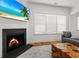 Inviting living room featuring a modern fireplace, large windows, and stylish decor at 277 Fiddleback Dr, Summerville, SC 29486