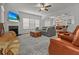 Comfortable living room with fireplace, large sofa, and open view to the kitchen and dining area at 277 Fiddleback Dr, Summerville, SC 29486