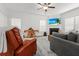 Cozy living room with fireplace, plush seating, and large windows for natural light at 277 Fiddleback Dr, Summerville, SC 29486
