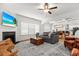 Bright living room featuring a fireplace, large windows, comfortable seating, and wood accents at 277 Fiddleback Dr, Summerville, SC 29486