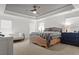 A luxurious main bedroom features a sitting area, dresser, ceiling fan, and neutral decor at 277 Fiddleback Dr, Summerville, SC 29486